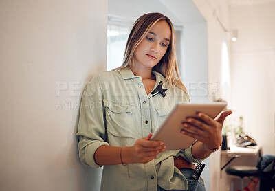 Buy stock photo Woman, small business and research on tablet for startup company browsing internet in remote work at salon. Professional freelancer female on touchscreen for online marketing or social media at home