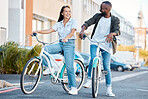 Bike, young couple and city street cycling in summer for eco friendly carbon footprint, love date and relax. Happy man, smile woman and diversity friends retro bicycle for sustainable urban adventure