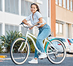 Bike, young woman and city portrait of student, gen z girl and influencer cycling in summer street for eco friendly carbon footprint. Happy asian female on vintage retro bicycle for urban adventure 