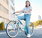 Woman, bicycle and smile for travel in the city, streets of a student relaxing in the outdoors. Portrait of a happy asian female traveling on cycling tour in a urban town on a bike in South Africa