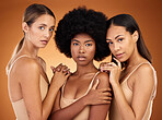 Diversity, women and cosmetics with natural beauty, proud and confident with brown studio background together. Portrait, makeup and girls being relax, sisterhood and magazine cover for skincare.