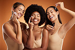 Beauty, skincare and diversity with a model woman group in studio on a brown background for antiaging or wellness. Product, skin and care with female friends posing together for health or cosmetics