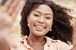 Selfie, face and frame with a black woman taking a photograph outside during a bright summer day. Portrait, beauty and smile with an attractive African American female posing for a picture outdoor