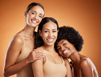 Buy stock photo Beauty, diversity skincare portrait of women with smile, makeup and cosmetics for natural skin and hair. Group of self love female models posing for wellness and health against brown background