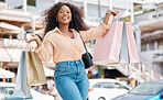 Shopping, fashion and retail, a black woman with smile and designer boutique shopping bags outside a mall. Happy customer or influencer after discount sale in city shopping mall parking lot or street