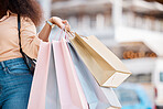 Shopping bag, sale and walking woman in the city of New York for fashion, retail and discount. Hands of a girl with bags in the street from a boutique, store or designer shop for luxury clothes