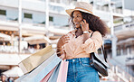 Phone call, black woman and shopping bags of a person from Miami feeling happy about shop experience. Sale, store and retail purchase of a person in the city with mobile technology and smile outdoor