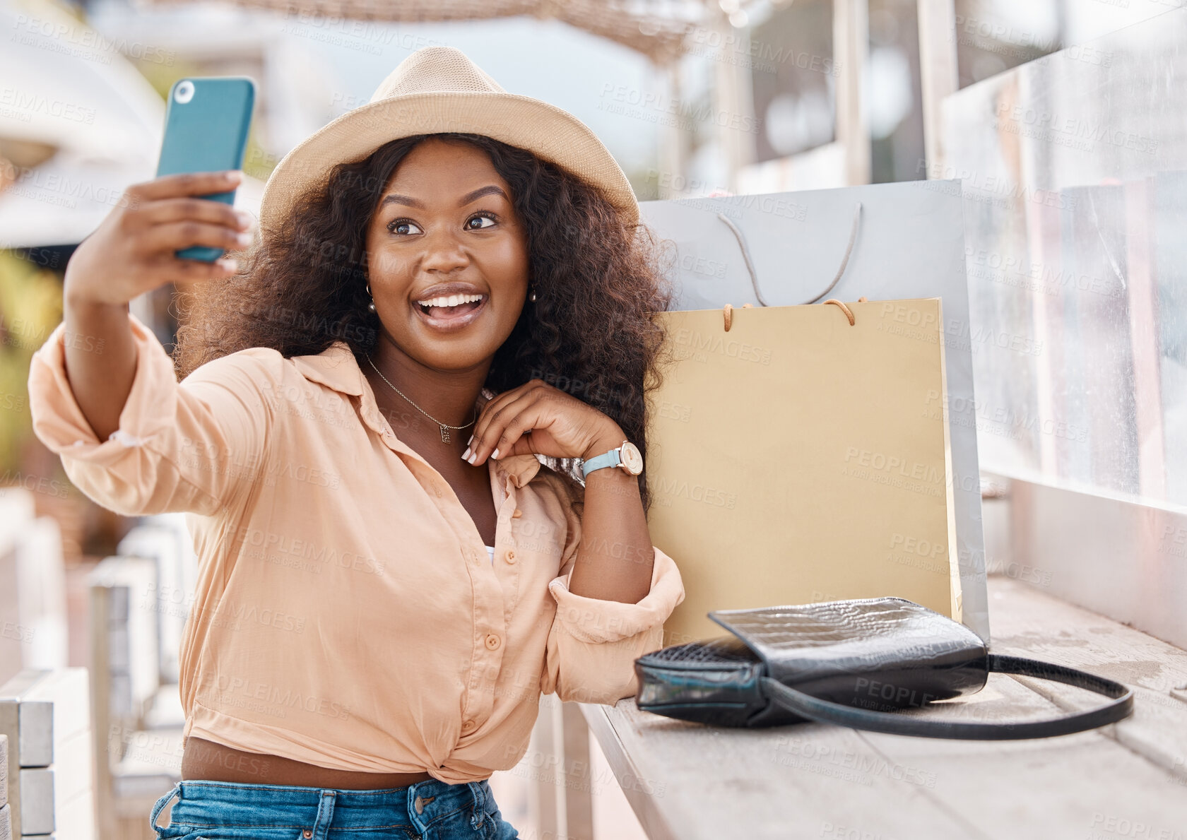 Buy stock photo Selfie, shopping bags and woman with phone, happy in hat at city cafe. At the mall, girl with smile and smartphone on 5g video call after discount sale at luxury fashion retail shop on summer holiday