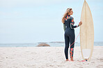 Woman, surfer and board on the beach for sports exercise, training and hobby in the summer outdoors. Professional female standing with surfboard by the ocean ready for sport surfing in South Africa