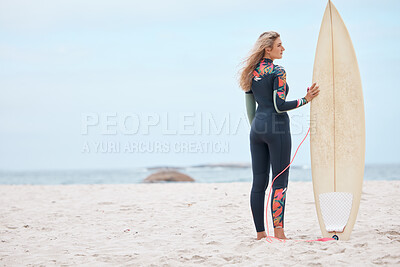 Woman, surfer and board on the beach for sports exercise, training and hobby in the summer outdoors. Professional female standing with surfboard by the ocean ready for sport surfing in South Africa