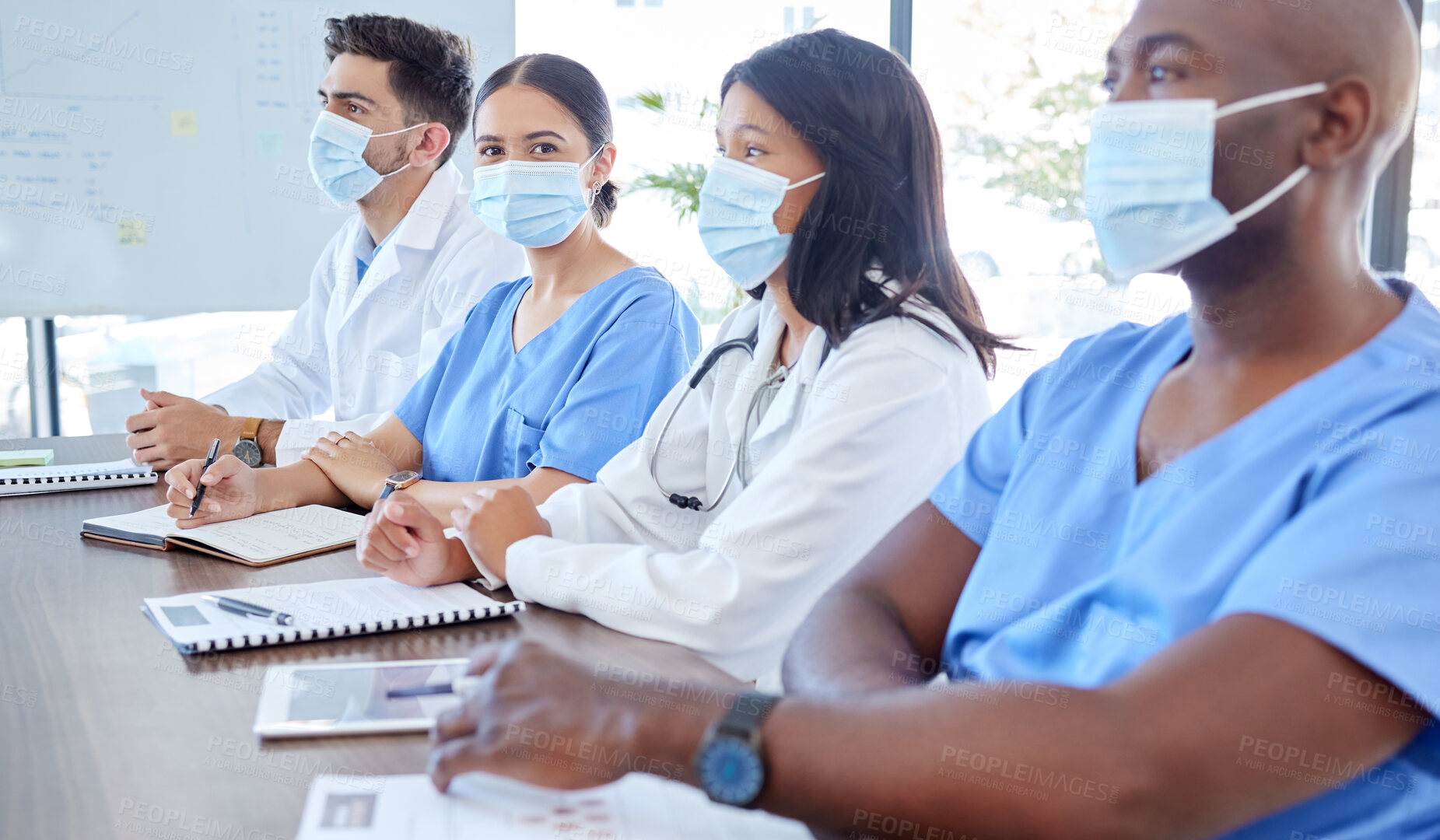 Buy stock photo Covid, planning and team of doctors in a meeting working on medical reports, documents and coronavirus solutions. Face mask, teamwork and healthcare workers talking of a strategy to help in pandemic 