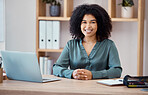Portrait of a black woman, office desk and professional business employee consultant in the workspace. Corporate finance worker, working with a laptop and notebook in modern marketing startup company