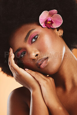 Buy stock photo Black woman, beauty and face, flower and makeup with natural cosmetology advertising closeup. African American model hands, glow with skincare and cosmetics treatment portrait in studio.