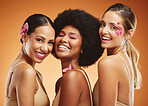 Beauty, diversity and smile with women and flowers for makeup, cosmetics and wellness. Tropical, natural and luxury with model in brown background for summer, creative and spa skincare treatment