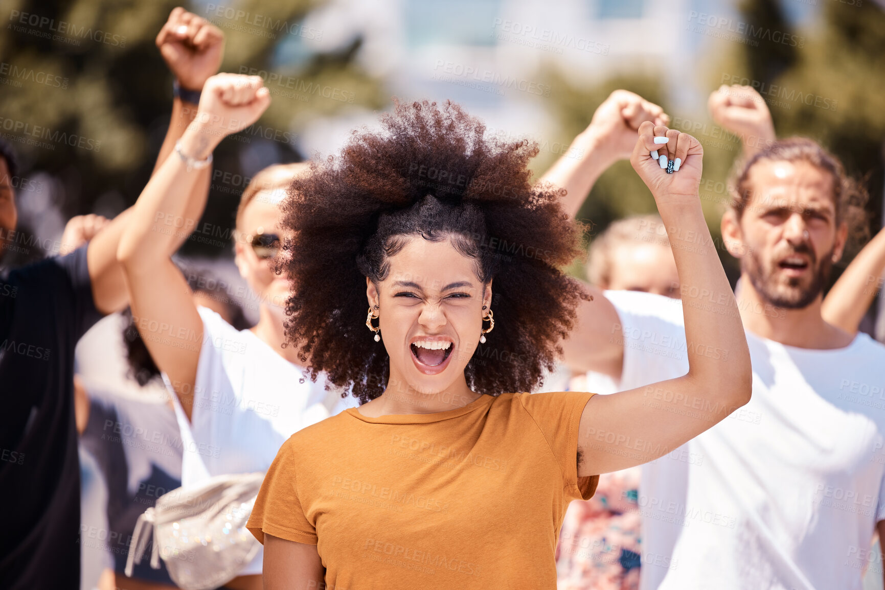 Buy stock photo Freedom, support and protest with black woman and fist with crowd in city street for global justice and human rights revolution and equality. Support, future and change with group of people in rally