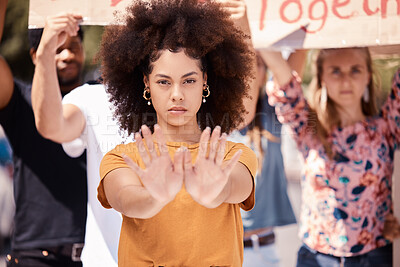 Buy stock photo Protest, hands and stop with a black woman activist in demonstration with a group of people ready to fight for freedom. Community, politics and rally with a young female standing against violence