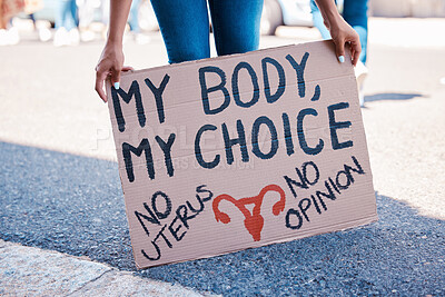 Buy stock photo Protest, woman and human rights poster for abortion activism choice, decision and discrimination. Feminist, politics and pregnancy termination activist rally sign for fetus law justice in city.


