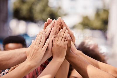 Buy stock photo Hands, teamwork and solidarity with a group of people standing outdoor in the city in a huddle or circle. Community, collaboration and motivation with a team doing a high five outside in a town