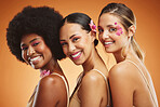 Beauty, skincare and diversity with a model woman group in studio on an orange background for health or inclusion. Wellness, hair and face with a portrait of female friends posing for empowerment