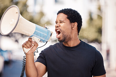 Buy stock photo Megaphone, protest and angry black man talking at riot in Nigeria. Announcement, loudspeaker and shouting or screaming male on bullhorn protesting for freedom, justice or government change in city.
