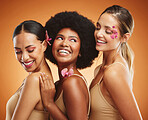 Skincare, diversity women and natural beauty being happy, smile and brown studio background with organic cosmetics. Makeup, female or girls with body care, floral and wellness for smooth skin or glow