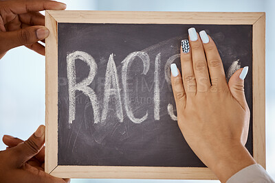 Buy stock photo Racism, protest and stop hands on blackboard to remove inequality writing for a change in society. Race, prejudice and black lives matter group cleaning chalkboard to erase word of hate closeup.