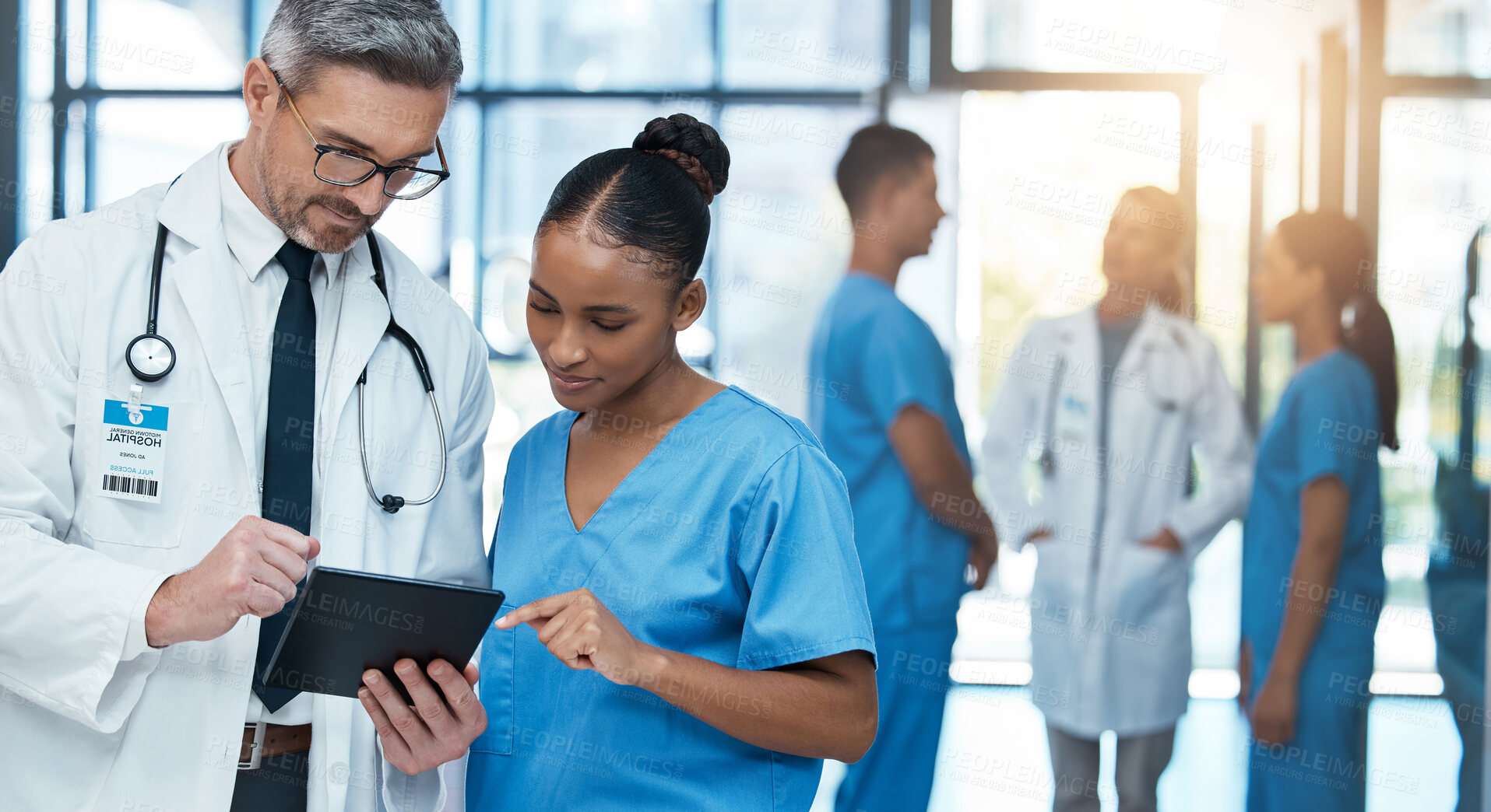 Buy stock photo Doctor, healthcare and research with nurse on tablet in collaboration for diagnosis or prescription at the hospital. Medical GP and employee working together on touchscreen for patient clinic history