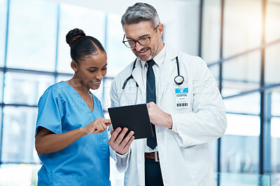 Buy stock photo Teamwork, tablet and healthcare with a doctor and nurse working together as a team in the hospital. Collaboration, internet and medical with a man and woman surgeon at work on an online diagnosis