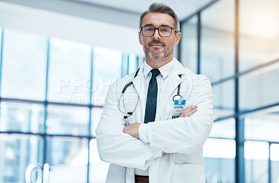 Doctor, senior man and arms crossed with glasses and stethoscope in medical healthcare clinic. Health medic research expert, science innovation leader and proud professional surgeon in hospital