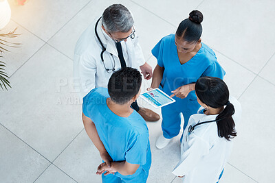 Buy stock photo Doctor, nurse and conversation with tablet from above, medical team meeting in hospital lobby for discussion. Healthcare, men and women doctors standing together for diversity, teamwork and planning.