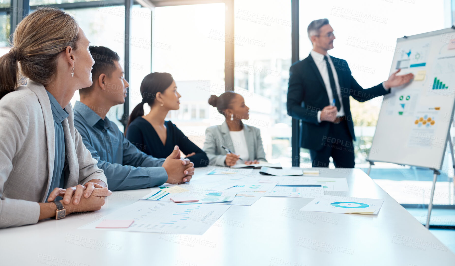 Buy stock photo Presentation, data and manager in a meeting about finance, sales and company growth at work. Corporate employees in business workshop for analysis of charts, financial analytics and strategy as team