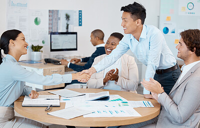 Buy stock photo Success, handshake and applause from business people in a meeting for reaching sales targets, goals and winning a deal. Smile, diversity and happy marketing manager shaking hands with office worker