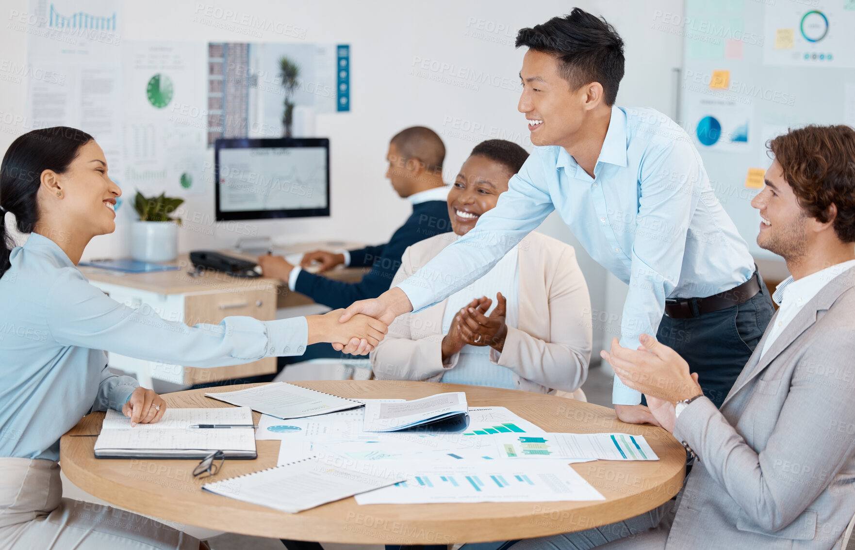 Buy stock photo Success, handshake and applause from business people in a meeting for reaching sales targets, goals and winning a deal. Smile, diversity and happy marketing manager shaking hands with office worker