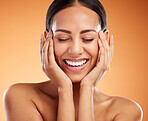 Skincare, smile and woman excited about face wellness against an orange mockup studio background. Happy, relax and beauty model with happiness for facial cosmetics, skin health and dermatology