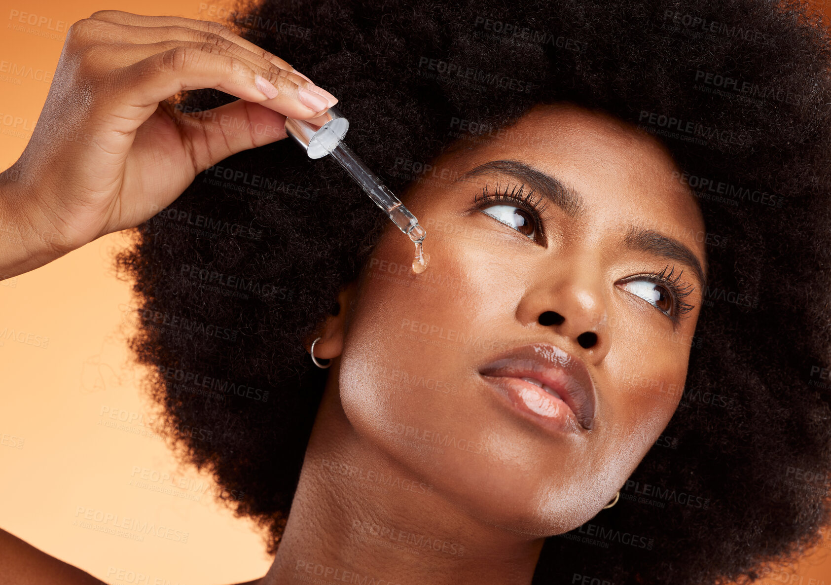 Buy stock photo Face serum, skincare and black woman using beauty oil product with pipette for skin. Wellness, afro and natural female model from Nigeria with a dermatology dropper for moisturizing facial treatment