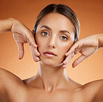 Skincare. beauty and woman with glow on face against an orange studio background. Portrait of a young, healthy and cosmetic model with body makeup, luxury dermatology and facial wellness and care