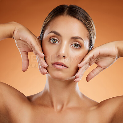 Buy stock photo Skincare, beauty and woman with glow on face against an orange studio background. Portrait of a young, healthy and cosmetic model with body makeup, luxury dermatology and facial wellness and care