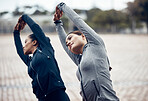 Fitness, woman and stretching in the city for workout, exercise and training together for health in the outdoors. Active women in morning routine stretch for cardio exercising in sports motivation