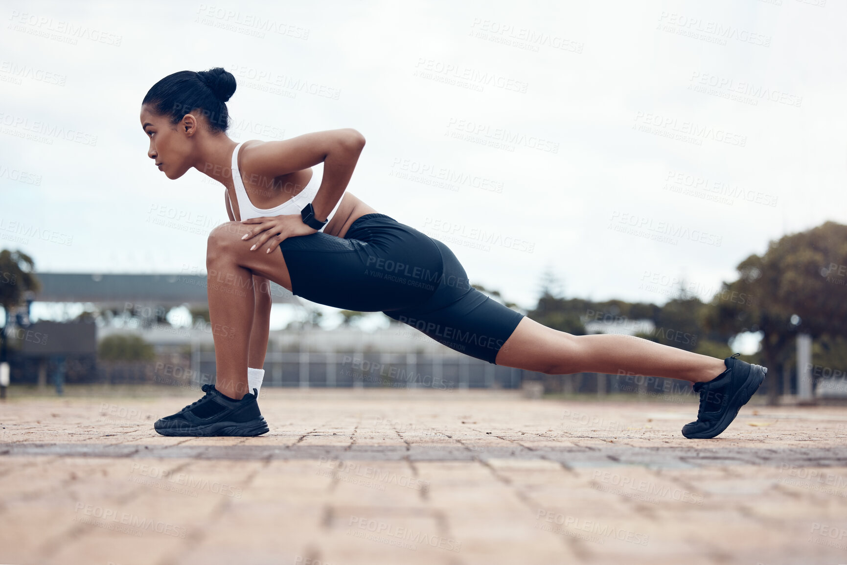 Buy stock photo Exercise, black woman and stretching outdoor for training, fitness and health in sportswear being focus. Female trainer, healthy girl and athlete doing wellness, workout warm up or cardio for running