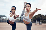 Yoga, stretching and women training in the city of Singapore for spiritual wellness and health together. Athlete friends with focus and balance during fitness exercise for peace and calm in street