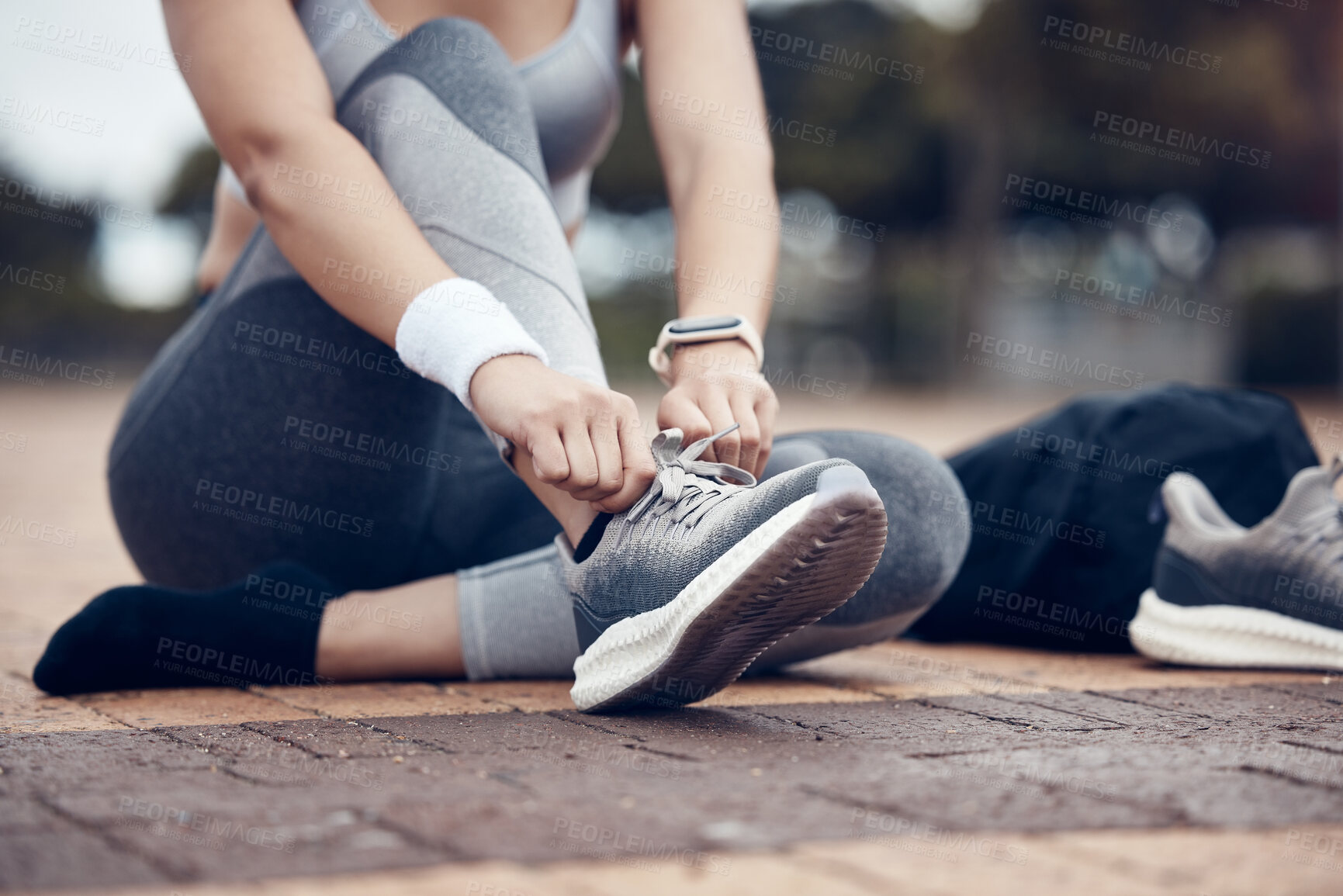 Buy stock photo Fitness, runner and woman with shoe lace in sports motivation for workout, exercise or training in the outdoors. Female tying shoes for a run in healthy sport for cardio exercising in a urban town
