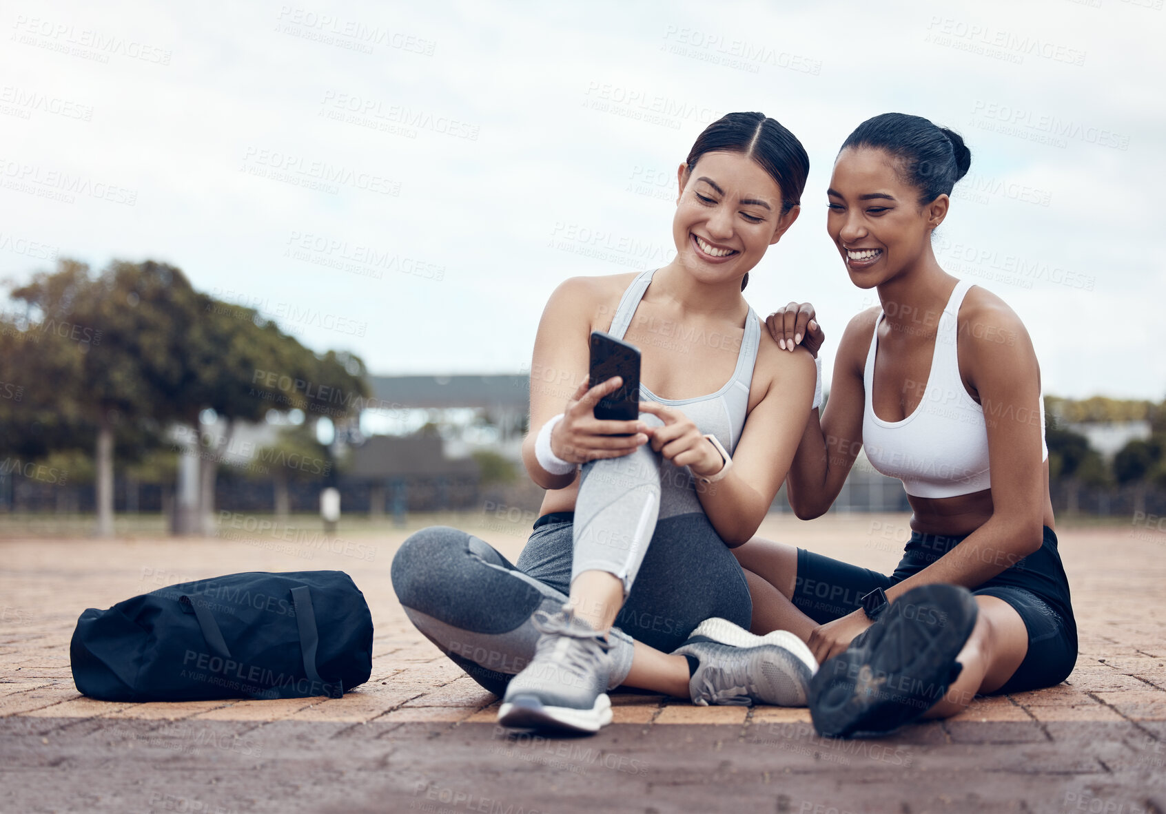 Buy stock photo Friends, fitness and phone app with women on internet happy about social media, motivation message or exercise goal. Female runner and athlete with smartphone during cardio workout break outdoor 
