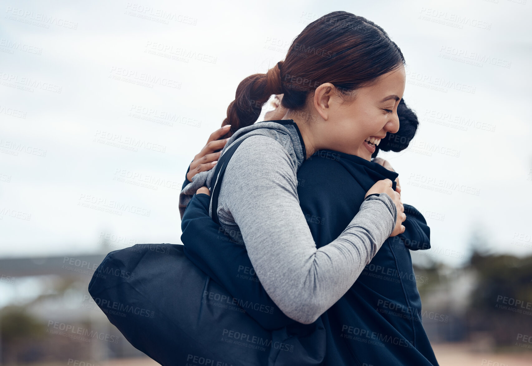 Buy stock photo Women, hug or support in fitness success, workout goals or exercise target in the Indonesian city. Smile, happy or celebration embrace sports people, bonding friends or runners after winning marathon