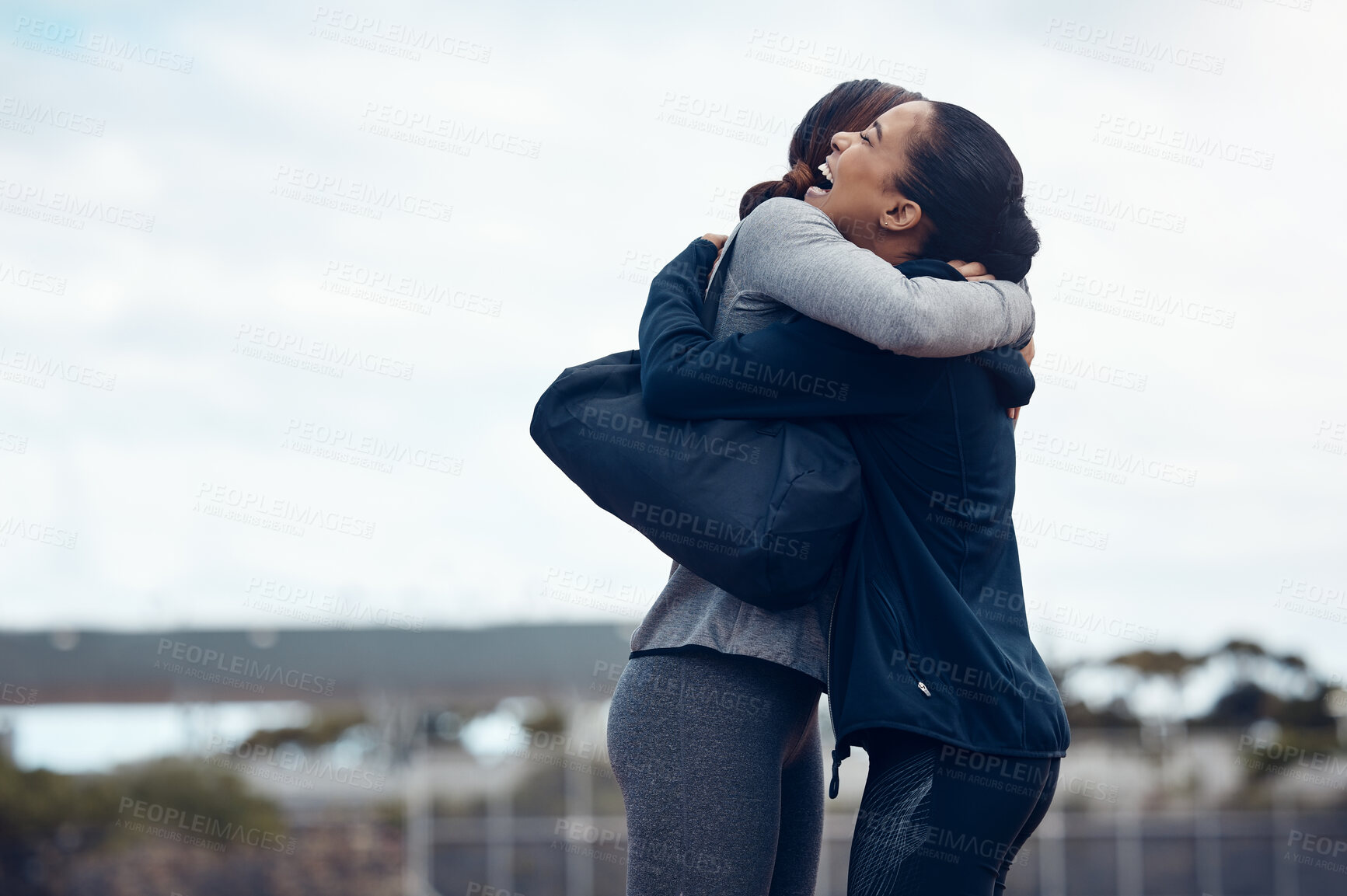 Buy stock photo Women, friends and happy hug in city, street or outdoors, bonding and affection after a long time. Love, smile and lesbian couple, females or girls meeting in town, hugging or joyful embrace together