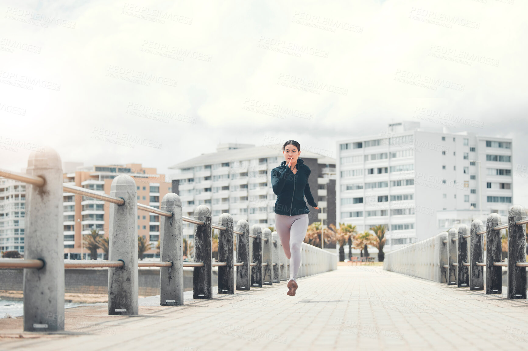 Buy stock photo Sports, fitness and woman running on sidewalk with speed, energy and determination outdoors for exercise in Los Angeles. Girl, wellness and healthy runner sprinting for cardio training and workout