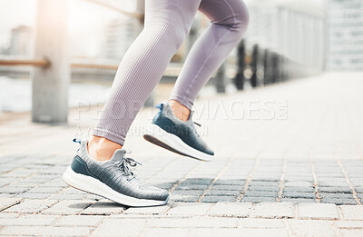 Buy stock photo Running shoes, feet sneakers and city cardio exercise, marathon and sports training in urban outdoor. Closeup woman athlete foot, legs and fast running speed of healthy fitness runner sprint movement