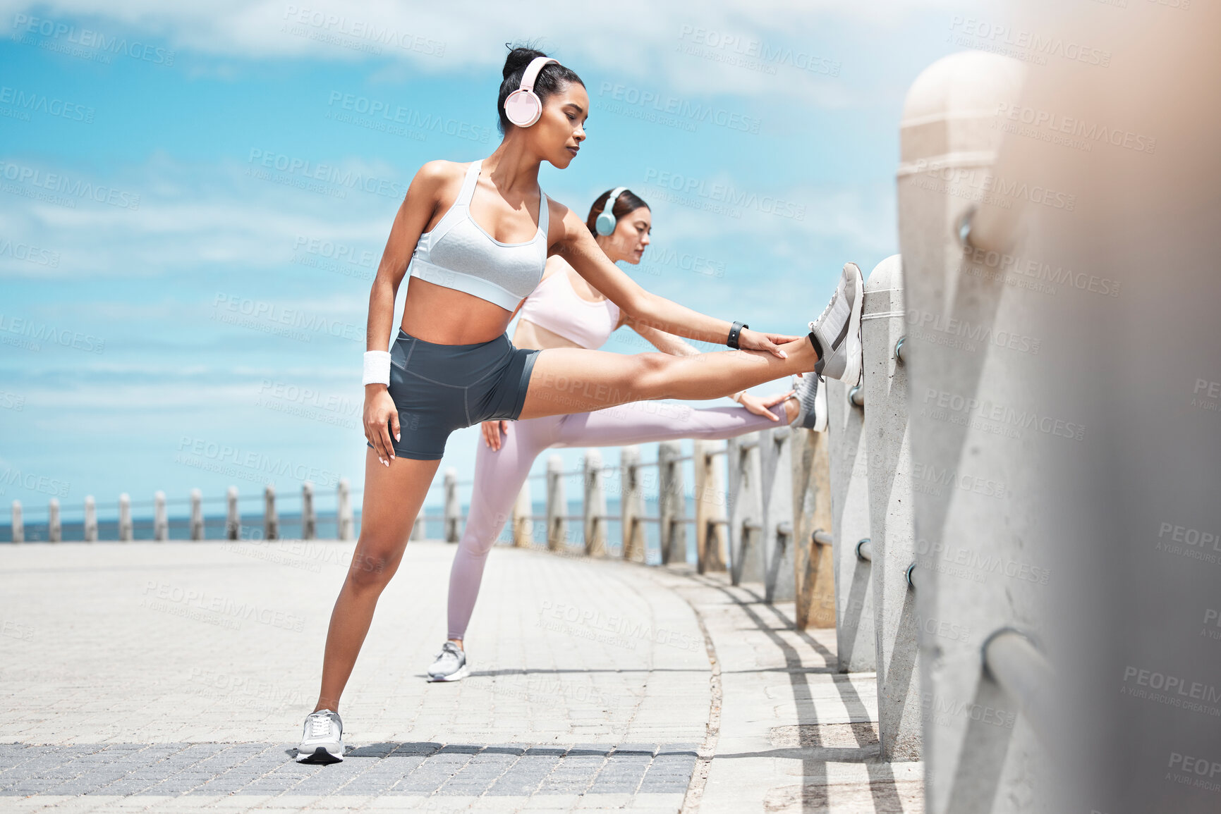 Buy stock photo Runner, team and fitness women stretching for body health, self care or wellness on cardio run, exercise or marathon training. Start, running workout or girl friends prepare for sports run with music