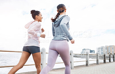 Buy stock photo Friends, women and running by ocean, sea promenade or beach for exercise, fitness and wellness. Motivation, happy and diversity girls outdoor for run, cardio workout or training together on promenade