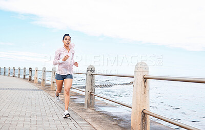 Buy stock photo Fitness, health or woman running by the beach, ocean or sea for wellness, workout or exercise for marathon or event. Motivation or runner sports girl training, run for cardio or healthy lifestyle
