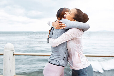 Buy stock photo Fitness, friends and women hug at the ocean, success and workout goals, celebration of teamwork with personal trainer. Health, exercise and training target, happy woman hugging friend at sea waves.